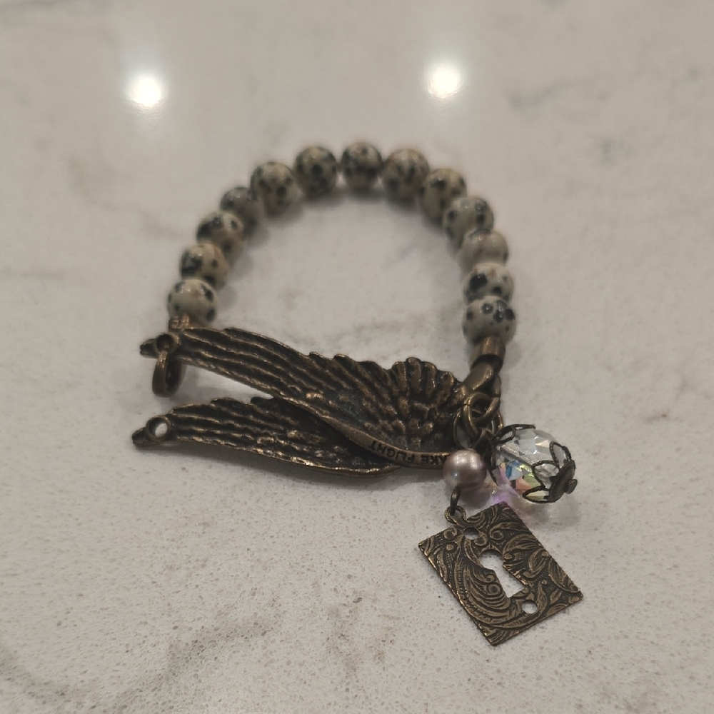 Elegant Beaded Bracelet with Charms